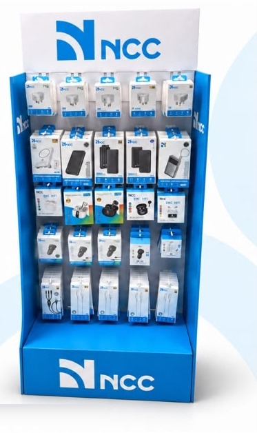 NCC display stand stocked with chargers, power banks, earbuds and cables